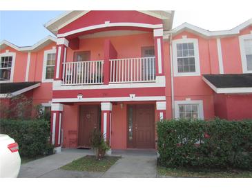 Charming townhome featuring a private balcony and well-maintained front yard at 261 Autumn Ln # 4, Kissimmee, FL 34743