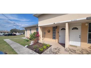 Inviting exterior featuring well-maintained landscaping and a charming entryway for a welcoming appeal at 2201 Club Cir # 2201, Lake Wales, FL 33898