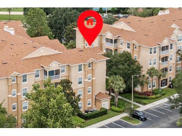 Beautifully landscaped condo complex with mature trees and well-maintained grounds at 7671 Comrow St # 303, Kissimmee, FL 34747