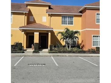 Beautiful townhome with lush landscaping and reserved parking in a desirable community at 8961 California Palm Rd, Kissimmee, FL 34747
