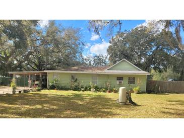 Charming single-story home with a well-maintained lawn and mature trees, offering a peaceful, shaded environment at 610 Buckley Dr, Kissimmee, FL 34741