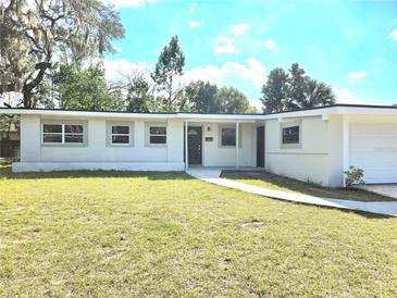 Charming single-story home with a well-maintained front lawn and inviting entrance at 5804 Viking Rd, Orlando, FL 32808