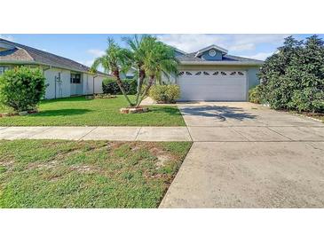 Charming single-Gathering home with a well-maintained lawn, mature landscaping, and a two-car garage at 832 Whalebone Bay Dr, Kissimmee, FL 34741