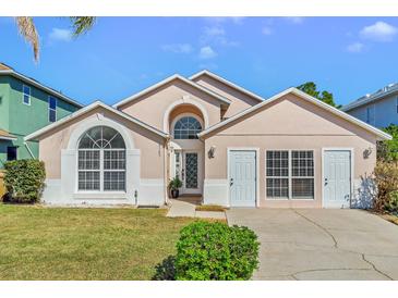 Charming single Gathering home with a well-maintained lawn and a symmetrically designed elevation at 8103 Yellow Crane Dr, Kissimmee, FL 34747