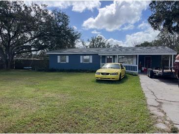 Charming single-story home with a spacious front yard and a long driveway for parking multiple vehicles at 4208 Ridge Rd, Lakeland, FL 33811