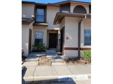Charming townhome with a well-maintained facade and inviting entrance at 2900 S Semoran Blvd # S, Orlando, FL 32822