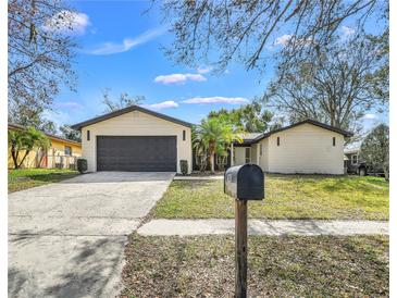 Charming single-story home with well-maintained lawn and attached two-car garage at 628 Eastwood Ct, Altamonte Springs, FL 32714