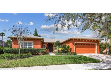 Charming single-story home with a well-maintained lawn and beautiful landscaping at 651 Highlands Hammock Dr, Poinciana, FL 34759