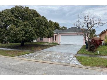 Charming single Gathering home with a large front yard and a two car garage at 2417 Lancashire Ln, Kissimmee, FL 34743