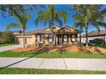 Charming single-story home featuring a two-car garage, well-maintained lawn, and a welcoming front porch at 2864 Lafayette Trace Dr, St Cloud, FL 34772