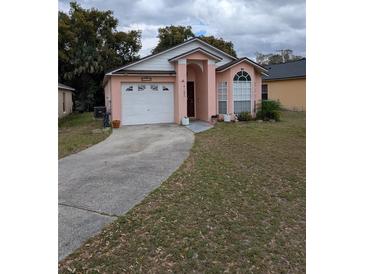 Charming single-Gathering home with a well-maintained lawn and inviting curb appeal at 7143 Edgewater Shores Ct, Orlando, FL 32810