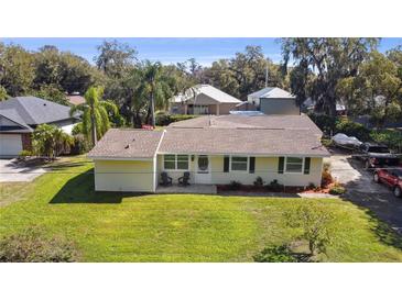 Charming single-story home with a well-maintained lawn and inviting curb appeal at 401 Woodlawn Ter, Kissimmee, FL 34744