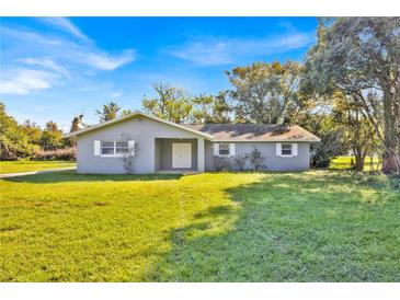 Charming one-story home with a well-maintained front yard and freshly painted exterior at 495 Orange Ave, St Cloud, FL 34769