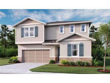 Two-story home featuring stone accents, siding, shutters, a two-car garage, and a well-manicured lawn at 276 Hilltop Bloom Loop, Haines City, FL 33844