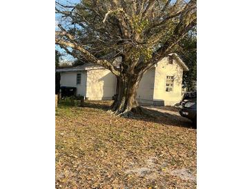 Cozy home exterior with mature tree coverage offering ample shade at 10538 Clarcona Ocoee Rd, Apopka, FL 32703
