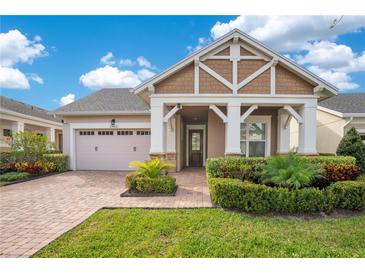 Charming single-Gathering home showcasing a well-manicured lawn and inviting brick pathway at 2460 Promenade Dr, St Cloud, FL 34772