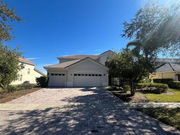 Charming home featuring a well-maintained yard, tile roof, and a spacious three-car garage at 3557 Valleyview Dr, Kissimmee, FL 34746