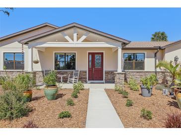 Beautiful single-story home with landscaped front yard and a welcoming entrance at 3607 Hidden River Ln, Tavares, FL 32778