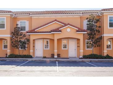 Charming multi-Gathering home with a colorful exterior, well-maintained landscaping, and convenient parking at 2652 Corvette Ln, Kissimmee, FL 34746