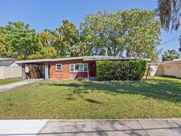 Charming single-story home with a well-maintained lawn and mature trees in a desirable neighborhood at 1921 Taylor Ave, Winter Park, FL 32792
