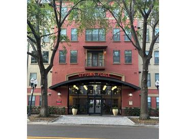 Attractive building entrance with covered entrance and 'Uptown Place' sign at 911 N Orange Ave # 142, Orlando, FL 32801