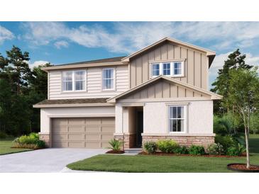 Charming two-story home with a two-car garage, beautiful stone accents and neutral color palette at 614 Heritage Square Dr, Haines City, FL 33844