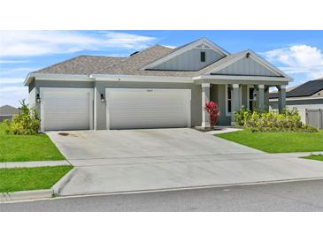 Charming single Gathering home with a well manicured lawn and 2-car garage at 14419 Topaghan Way, Winter Garden, FL 34787