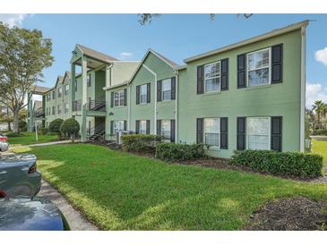 View of the charming apartment complex featuring well-manicured landscaping at 2031 Dixie Belle Dr # Q, Orlando, FL 32812