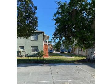 Two story home featuring large lawn in front at 723 Michigan Ct # 3, St Cloud, FL 34769