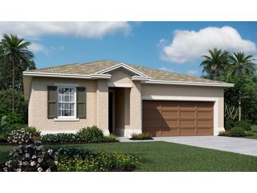 Charming single-story home featuring a two-car garage, landscaped front yard, and neutral color palette at 1110 Olivine Ave, Dundee, FL 33838