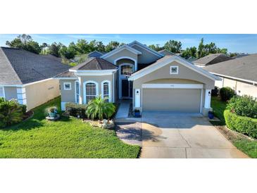 Charming single-story home with well-manicured lawn and inviting curb appeal at 121 Fitzgerald Ln, Davenport, FL 33837