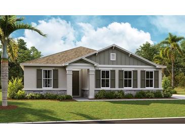 Charming one-story home with a well-manicured lawn, stone accents, a covered entryway, and tasteful landscaping at 2955 Gavin Sky Dr, Kissimmee, FL 34744