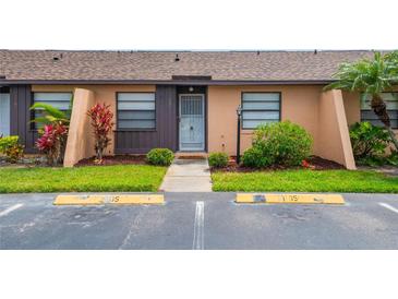 Charming condo with lush landscaping, well-maintained lawn and an inviting front entrance at 2305 St Marteen Ct # 2305, Kissimmee, FL 34741