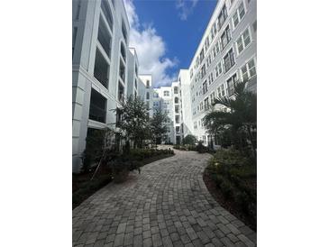 Beautiful courtyard featuring lush landscaping, pavers, and elegant architecture offering a serene escape at 304 E South St # 5020, Orlando, FL 32801
