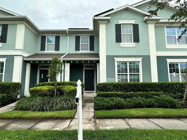 Inviting two-story townhouse with a well-manicured lawn and coordinated exterior colors at 4710 Nathan Hale Blvd, St Cloud, FL 34769