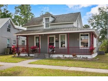 Charming two-story home with a quaint covered porch and inviting curb appeal at 514 Massachusetts Ave, St Cloud, FL 34769