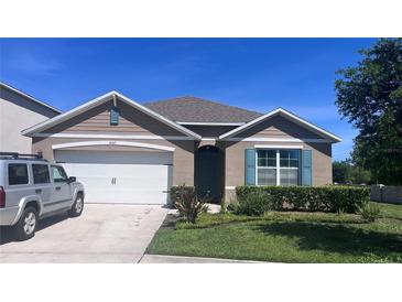 Charming one-story home featuring a two-car garage, well-maintained lawn, and neutral color palette at 4147 Sherlock Ct, Orlando, FL 32824
