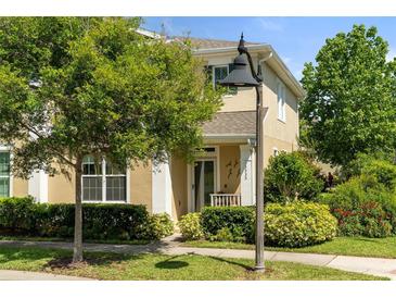 Charming home with lush front yard landscaping, decorative address display, and covered entry at 3535 Clay Brick Rd, Harmony, FL 34773