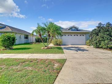 Charming single-Gathering home with well-manicured lawn and a two car garage at 832 Whalebone Bay Dr, Kissimmee, FL 34741