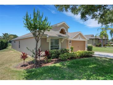 Charming single-Gathering home with well-maintained landscaping and inviting curb appeal at 265 Del Sol Ave, Davenport, FL 33837