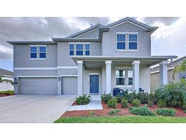 Beautiful two-story home with a two-car garage, covered porch, and well-maintained landscaping at 4190 Bull St, St Cloud, FL 34772