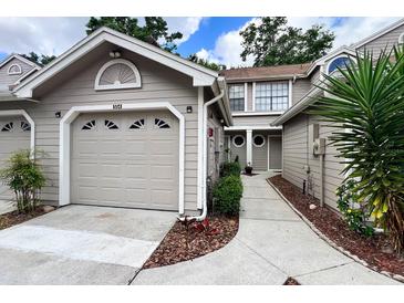 Charming townhome exterior with neutral siding, attached garage, and well-maintained landscaping at 554 Northbridge Dr, Altamonte Springs, FL 32714