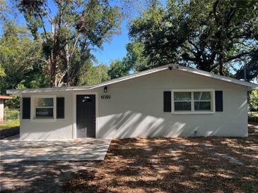 Charming single story home featuring a freshly painted exterior, dark shutters, and a well-manicured front yard at 3815 Nw Avenue R Ave, Winter Haven, FL 33881