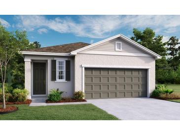 Charming single-story home featuring a two-car garage, covered entry, and well-maintained landscaping at 804 Lake Dell Rd, Dundee, FL 33838