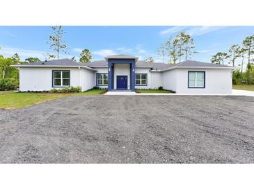 Charming single-story home with gray paint, new roof, and a well-manicured gravel yard at 19182 Seaview St, Orlando, FL 32833