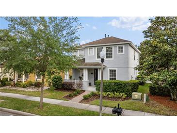Charming two-story home with a well-manicured lawn and inviting curb appeal at 14314 Pleach St, Winter Garden, FL 34787