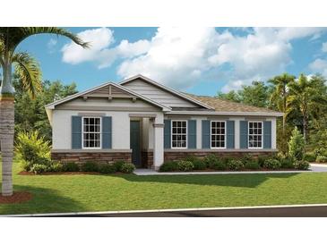 Charming single-story home with stone accents, blue shutters, and lush green lawn at 1003 Cloud Ridge Ct, Mount Dora, FL 32757