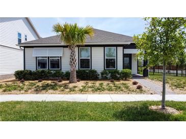 Inviting single-story home with well-manicured lawn, featuring a charming palm tree in the front yard at 6514 Barnstorm Way, St Cloud, FL 34771