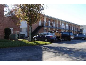 Brick building exterior with black stairs and parking at 781 W Lancaster Rd # B38, Orlando, FL 32809