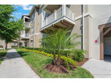 Attractive exterior with well-maintained landscaping, balconies, and architectural details at 1231 Wright Cir # 108, Kissimmee, FL 34747